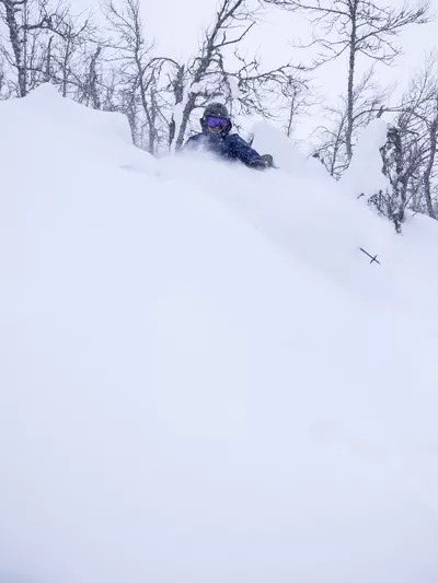 Skiier in deep snow in Hemsedal